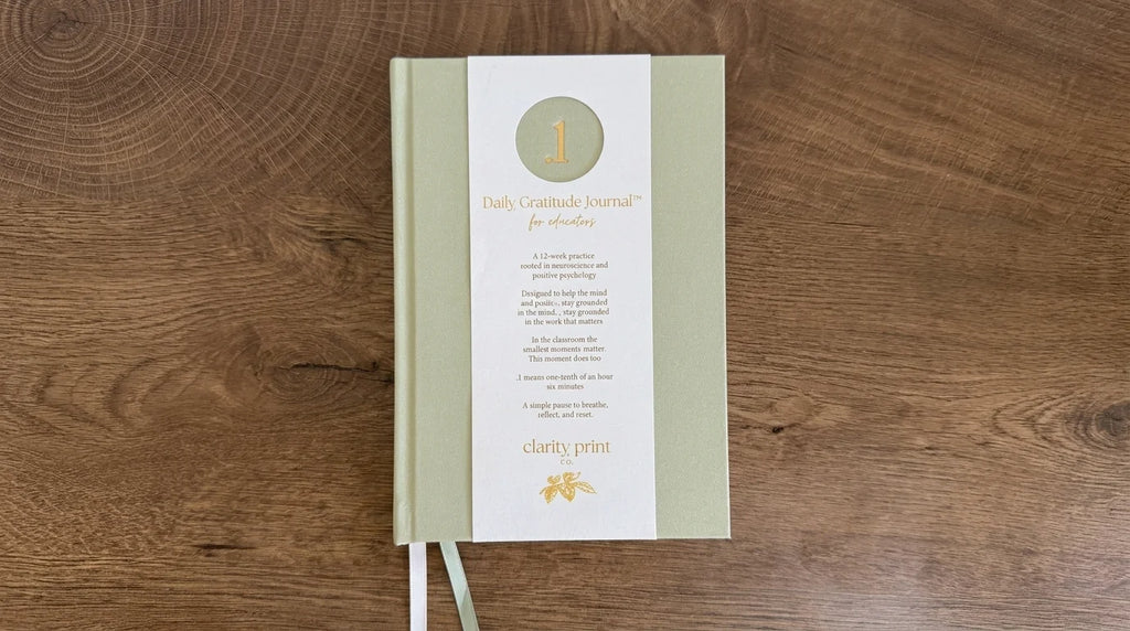 Daily Gratitude Journal on a wooden surface