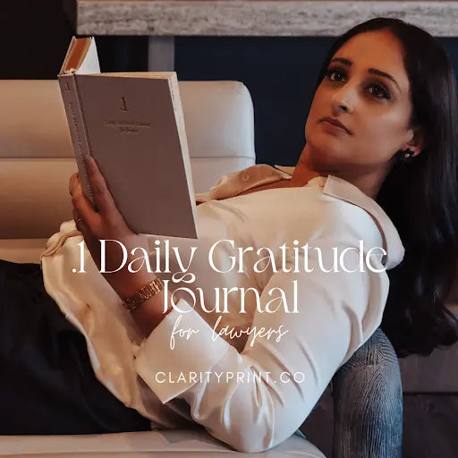 A cinematic product showcase of The .1 Daily Gratitude Journal for lawyers by Clarity Print Co., featuring high-quality paper, guided mindfulness prompts for attorneys, and an elegant linen cover.
