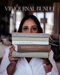 Woman holding a stack of journals with text on the cover, titled 'VIP Journal Bundle'.