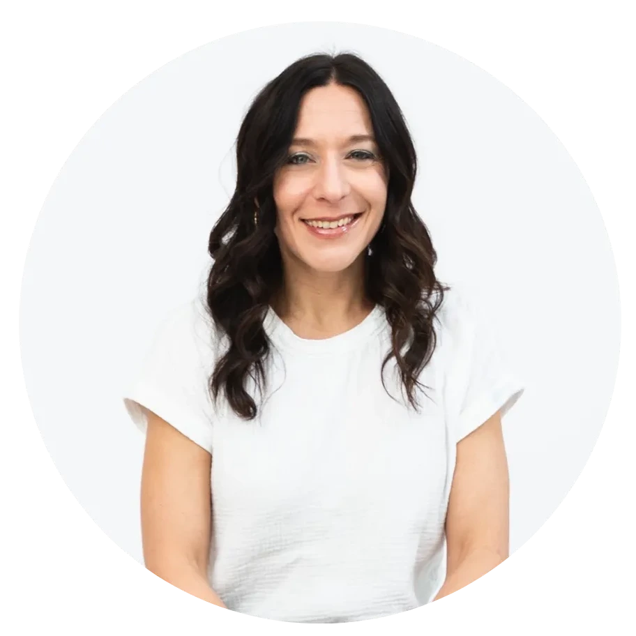 Woman wearing a white t-shirt on a plain background